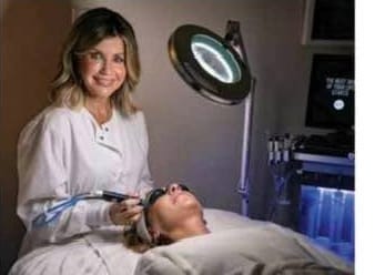 Licensed esthetician Kim Amos performing a HydraFacial