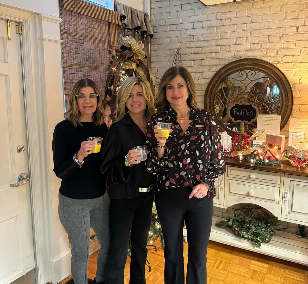 La Bella Donna staff sharing a toast at a client celebration